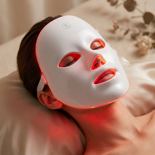 Model wearing Velle LED Photon Light Therapy Mask with red light